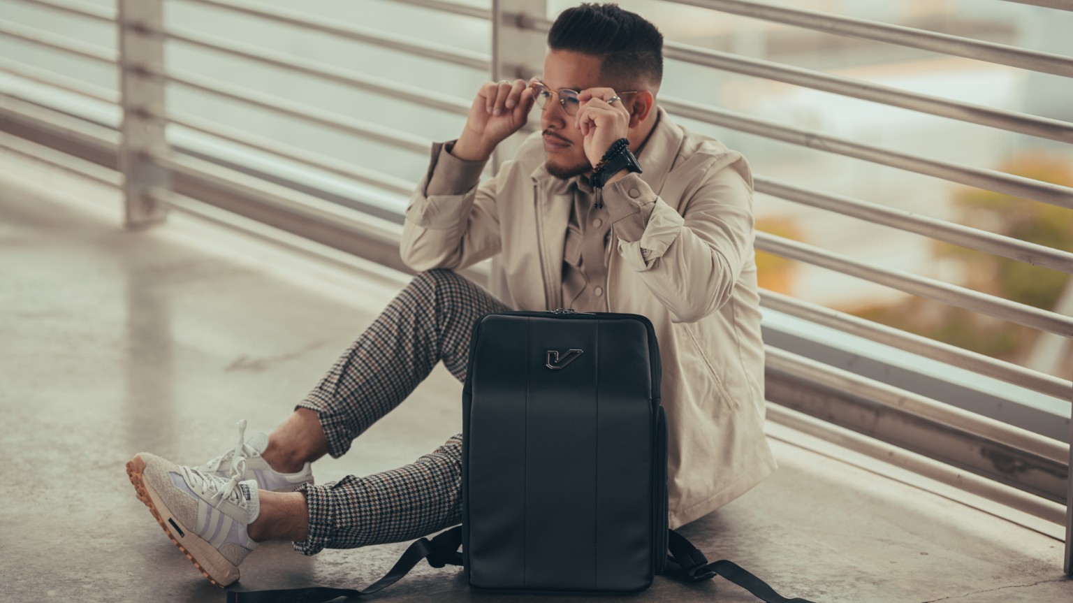 Kevin Michael Chong seated beside a black GruvGear bag