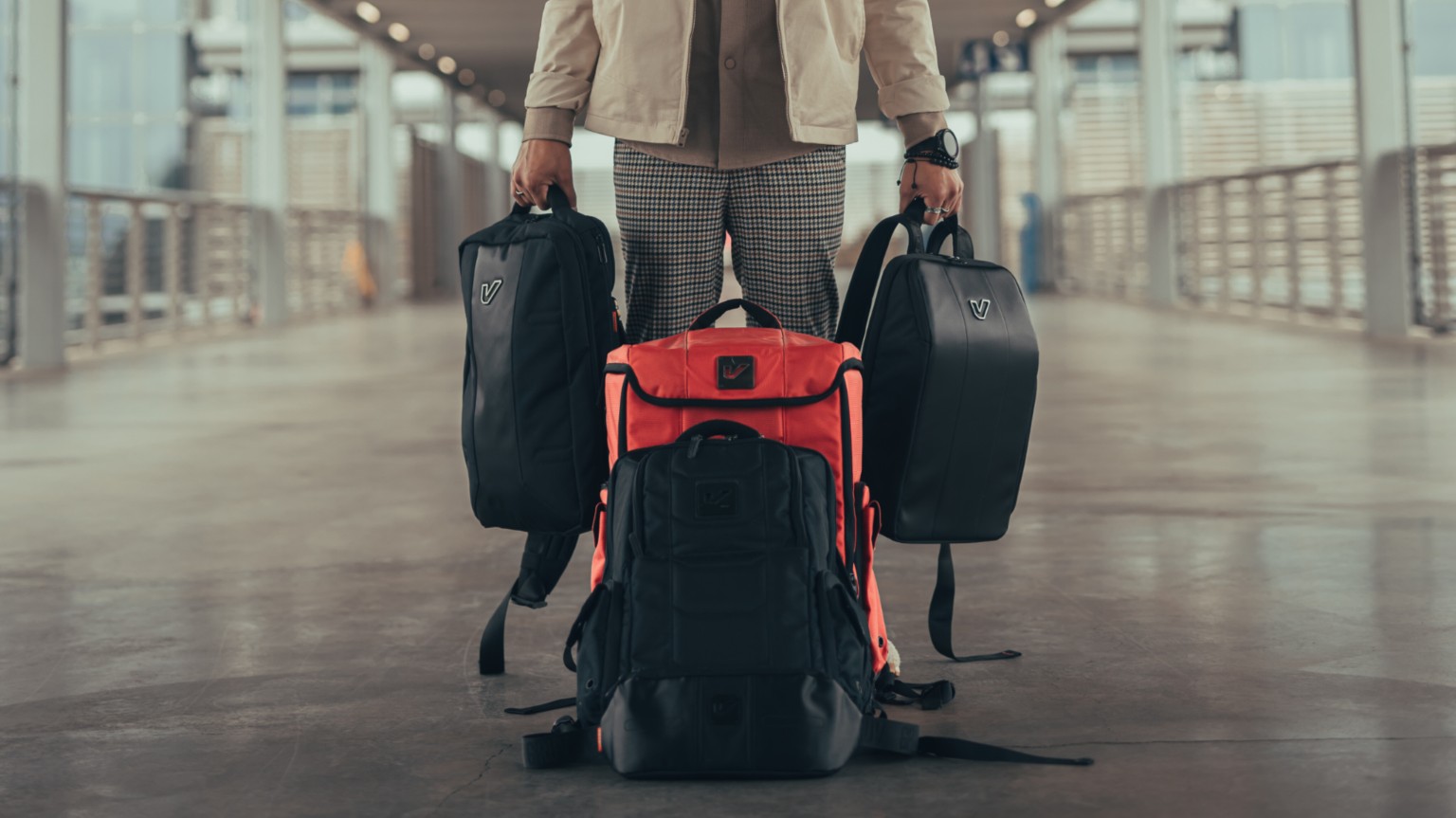 Kevin Michael Chong carrying GruvGear bags in a covered walkway