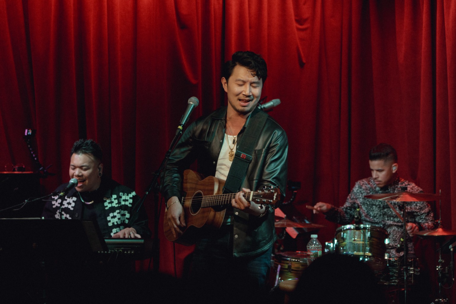 Kevin Michael Chong playing drums as Simu Liu performs at Hotel Café