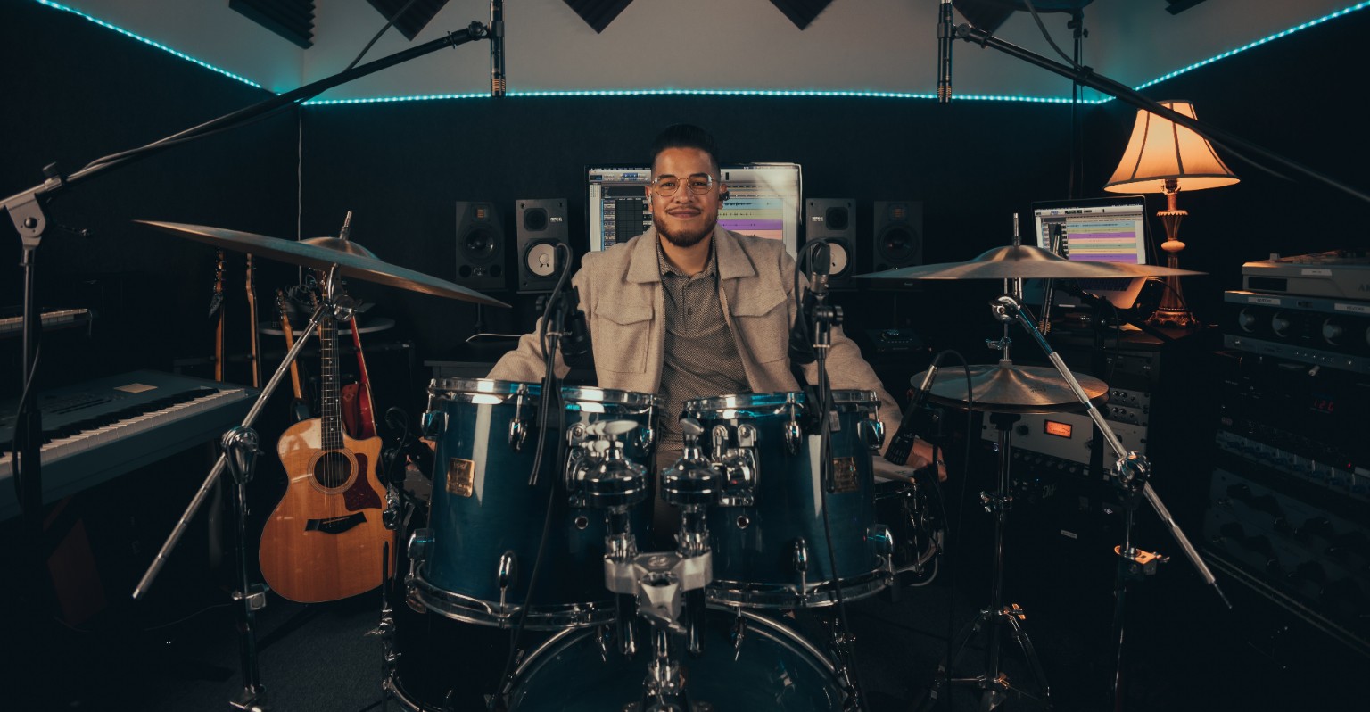 Kevin Michael Chong seated behind his drum kit during an Audix session
