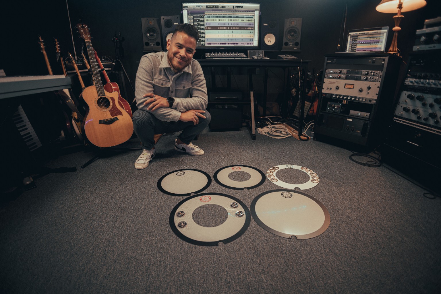 Kevin Michael Chong with Big Fat Snare Drum accessories in a recording studio