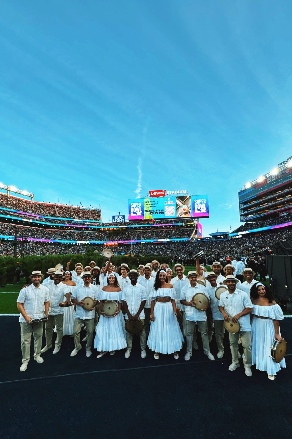 Super Bowl LX halftime performers gathered on the field at Levi's Stadium