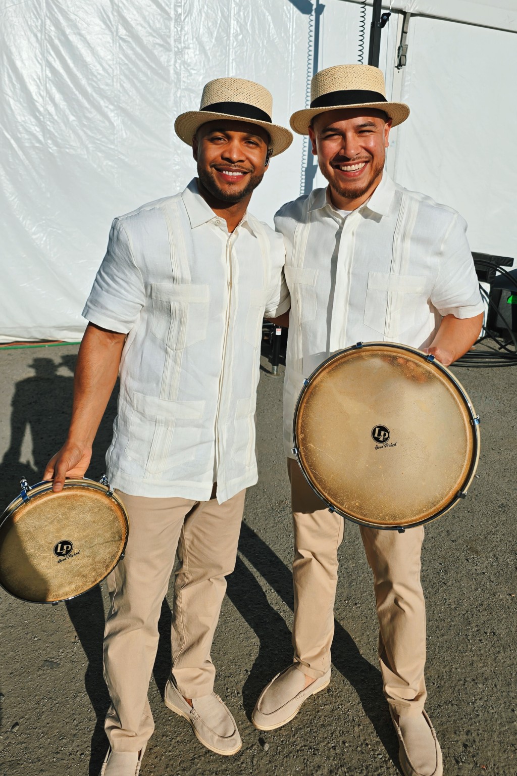 Kevin Michael Chong and a fellow plenero holding their drums backstage